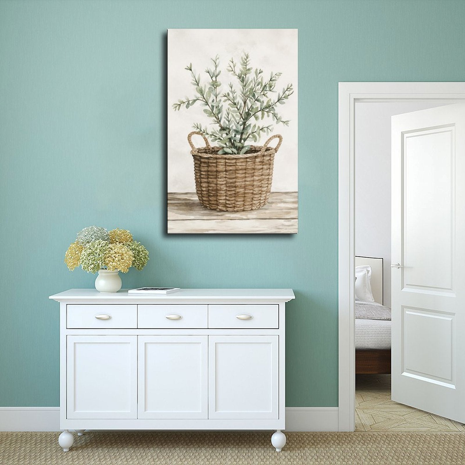 woven basket with silvery green leafy branches in sage green, warm beige, cream tones — Wrapped Canvas SCENE_02