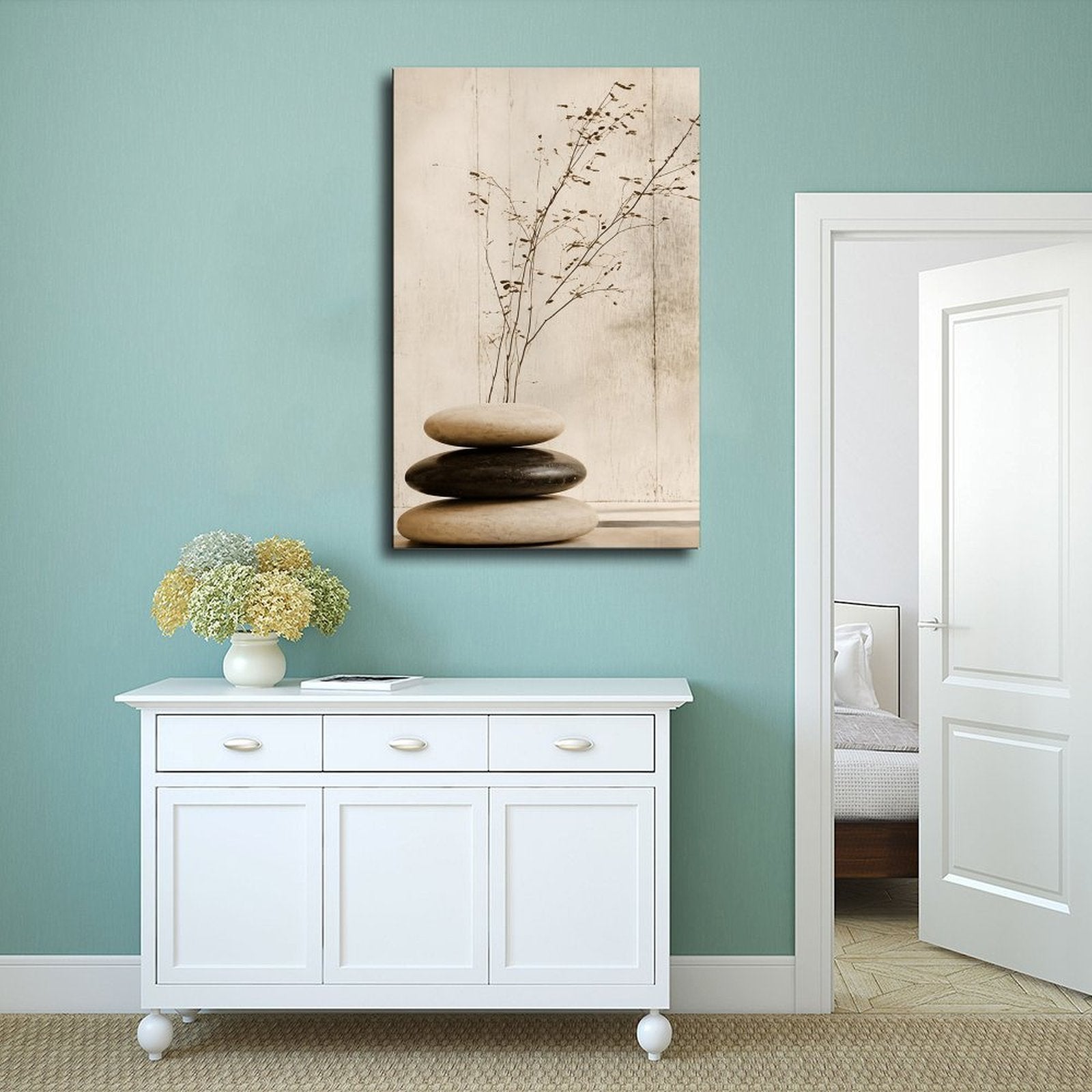 stacked smooth stones with a sparse dried branch in cream, taupe, charcoal tones — Wrapped Canvas SCENE_02