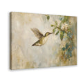 hummingbird hovering beside pale blossoms in cream, sage green, soft blue tones — Wrapped Canvas HERO